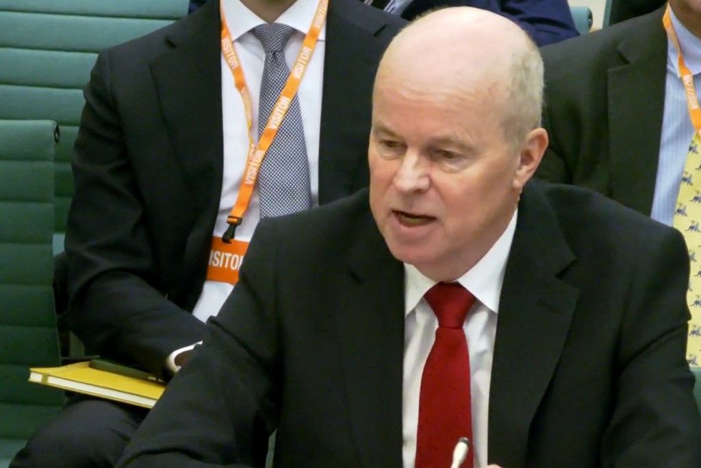 A video grab from footage broadcast by the UK Parliament's Parliamentary Recording Unit (PRU) shows BBC Board member, Robbie Gibb giving evidence to a hearing of the Culture, Media & Sport Select Committee at Portcullis House in London on November 24, 2025. (Photo by PRU / AFP) 