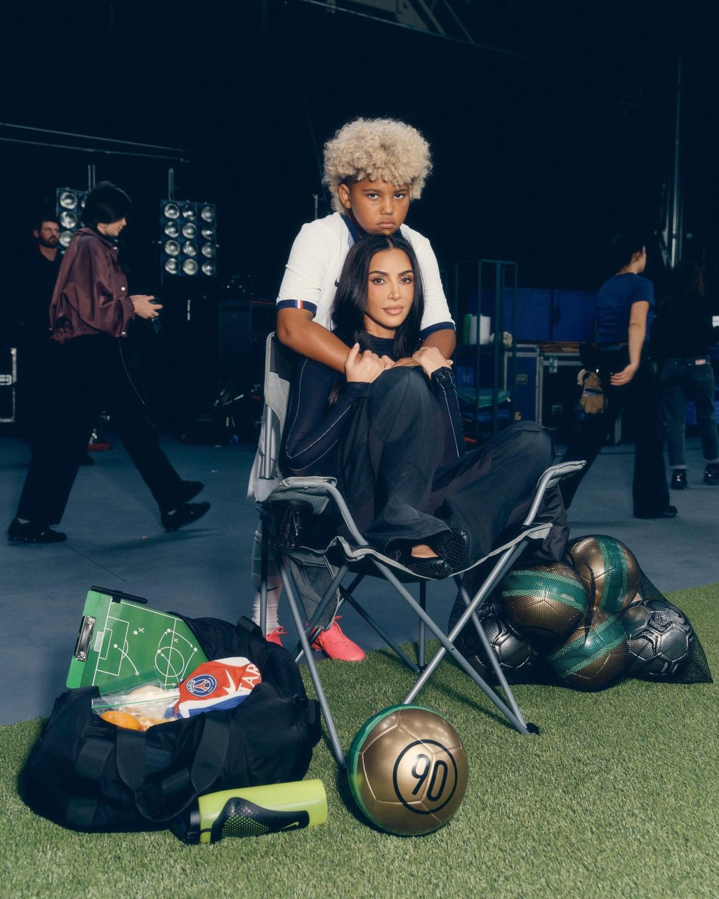 TV star Kim Kardashian is fully embodying the role of a "Soccer mom," even in Nike's latest campaign.
