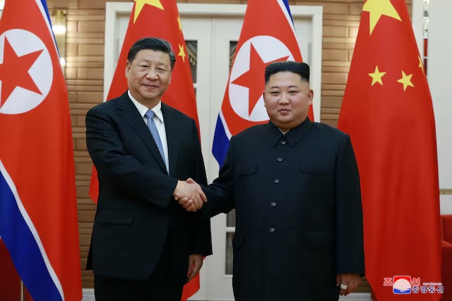 North Korean leader Kim Jong Un shakes hands with China's President Xi Jinping during Xi's visit in Pyongyang, North Korea in this undated photo released on June 21, 2019 by North Korea's Korean Central News Agency (KCNA). KCNA via REUTERS