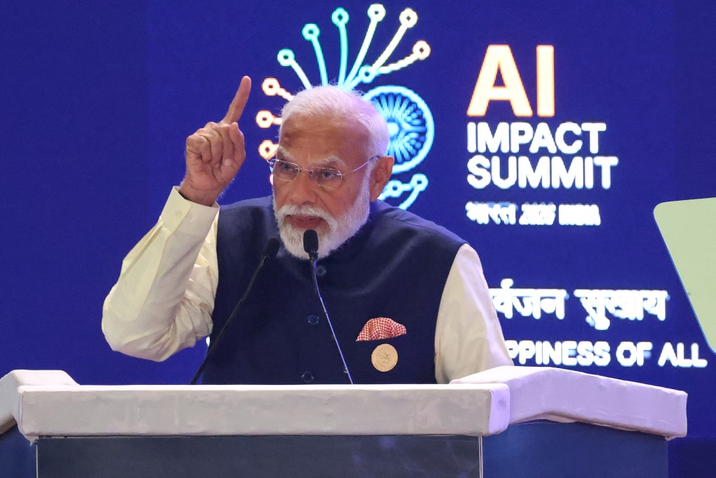 India's Prime Minister Narendra Modi delivers a speech at the AI Impact Summit in New Delhi on February 19, 2026. (Photo by Ludovic MARIN / AFP)