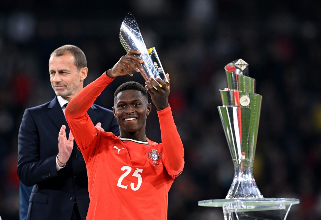 Portugal's Nuno Mendes celebrates with a trophy after winning player of the tournament. (Reuters)