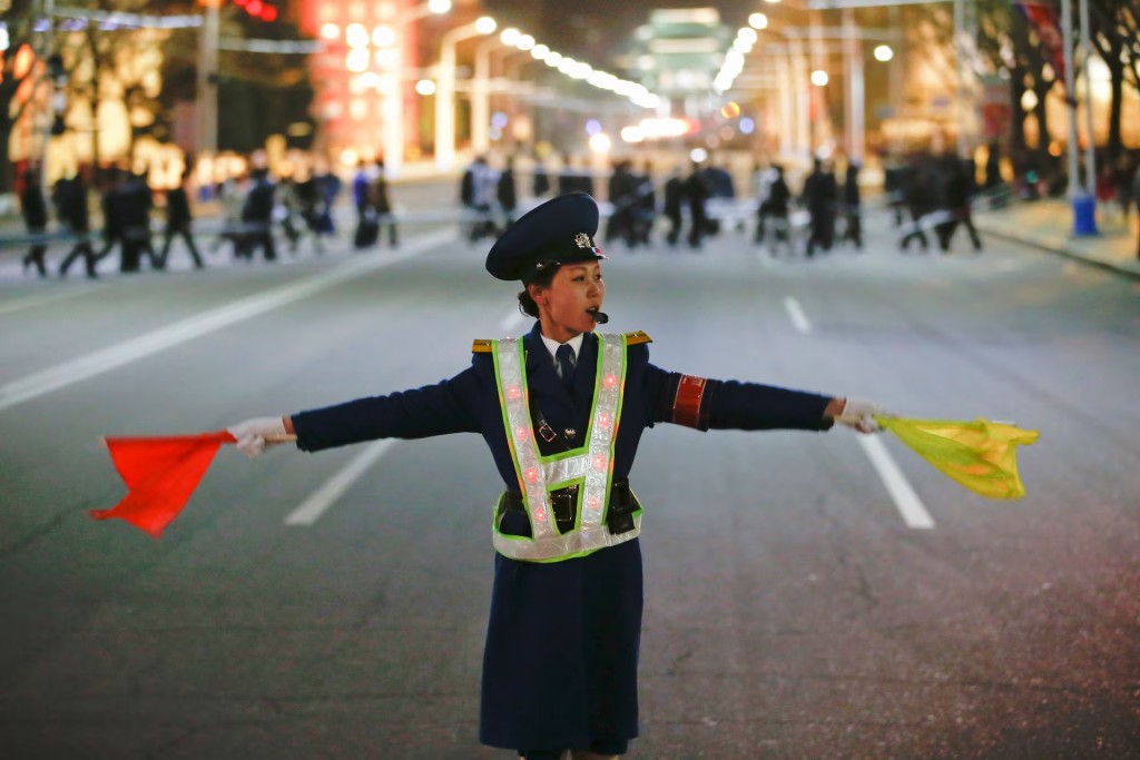 A policewoman controls the traffic in Pyongyang in 2017. An influx of vehicles into North Korea over the past couple of years has transformed the streets of the capital. REUTERS/Damir Sagolj