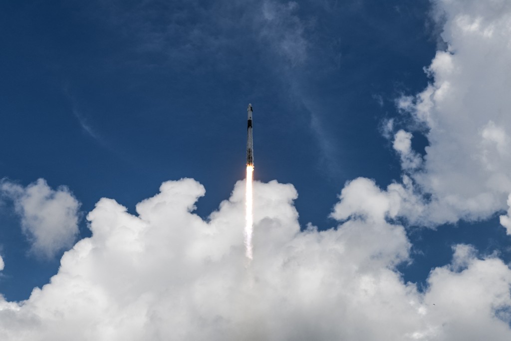 A SpaceX Falcon 9 rocket with the Crew Dragon capsule Endeavour carrying the Crew-11 mission lifts off from Launch Complex 39A at NASA’s Kennedy Space Center in Florida on August 1, 2025. (Photo by CHANDAN KHANNA / AFP)