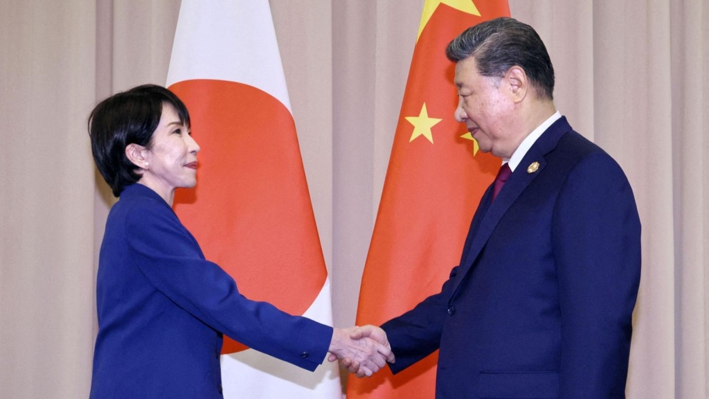 Japanese PM Sanae Takaichi shakes hands with President Xi Jinping ahead of their talks in Gyeongju, South Korea. Reuters
