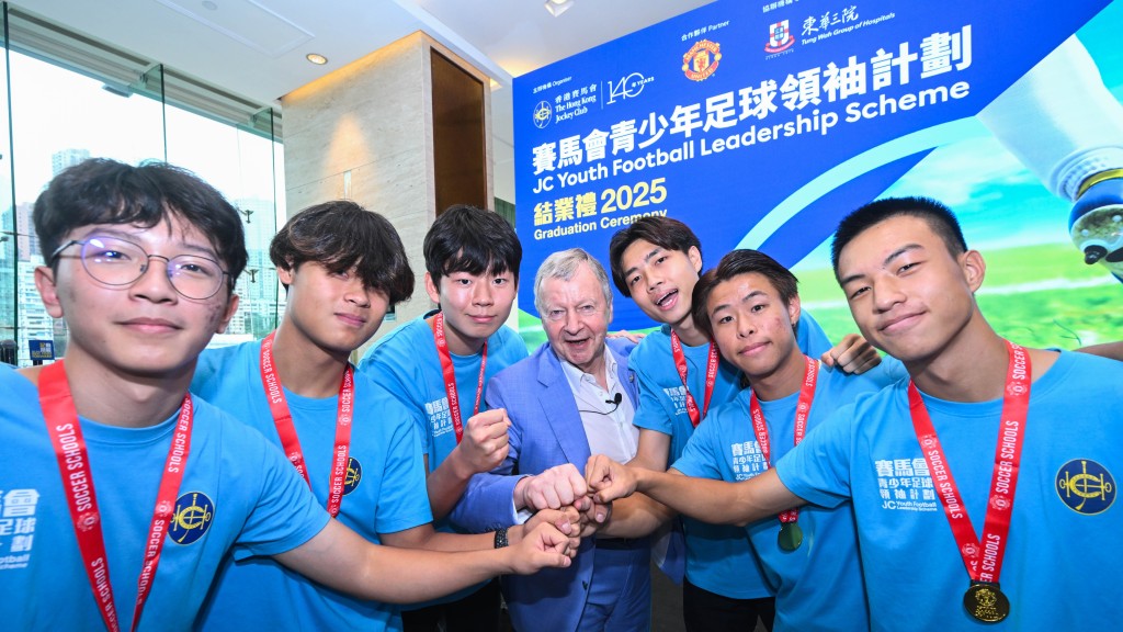 The Hong Kong Jockey Club’s Chief Executive Officer, Winfried Engelbrecht-Bresges with six outstanding leaders of the 10th JC Youth Football Leadership Scheme. They have been awarded an opportunity to visit Manchester.