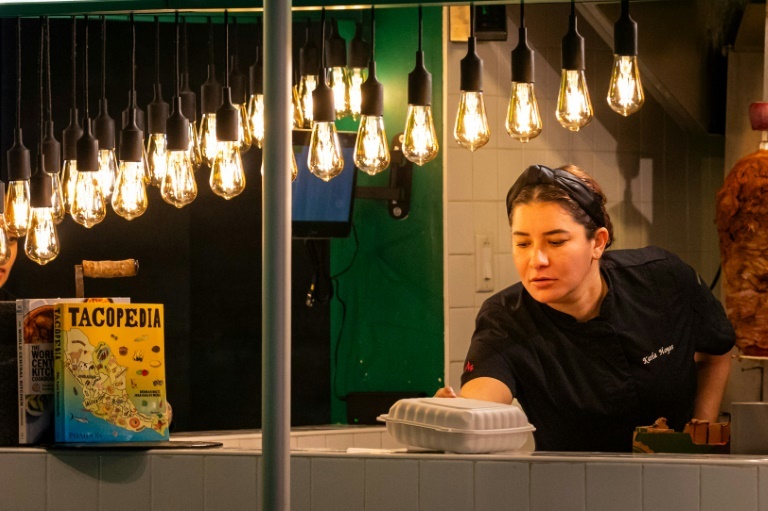 Karla Hoyos, a volunteer chef for World Central Kitchen (WCK), prepares food at her Miami restaurant Eva Marie UZCATEGUI Karla Hoyos, a volunteer chef for World Central Kitchen (WCK), prepares food at her Miami restaurant Eva Marie UZCATEGUI