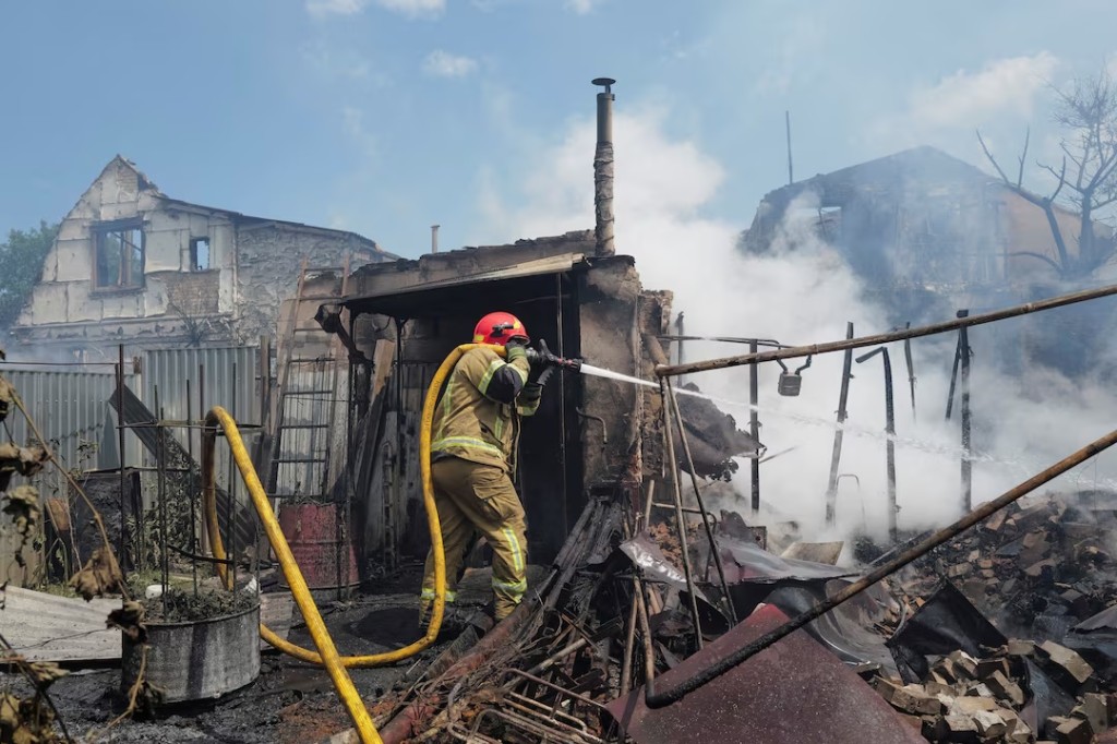 A firefighter works at a site of a Russian missile and drone strikes, amid Russia’s attack on Ukraine, on the outskirts of Kyiv, Ukraine July 6, 2026. REUTERS/Viacheslav Ratynskyi