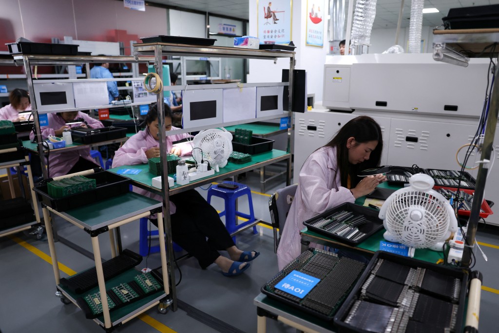 Employees inspect printed circuit boards at a factory, which is in partnership with Agilian Technology, in Dongguan, Guangdong province, China March 16, 2026. (Reuters)