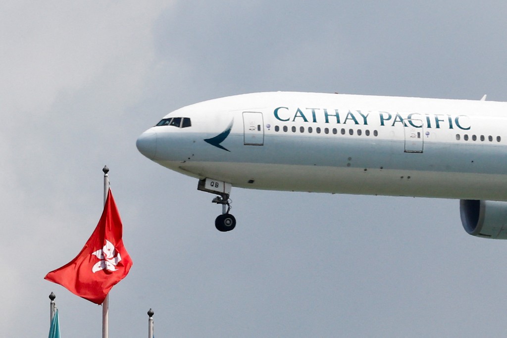 Caption: A Cathay Pacific Boeing 777-300ER plane lands at Hong Kong airport in Hong Kong, China August 14, 2019. REUTERS