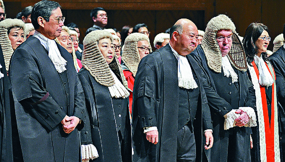 Barristers are easily recognizable in their court dress. Sing Tao Barristers are easily recognizable in their court dress. Sing Tao