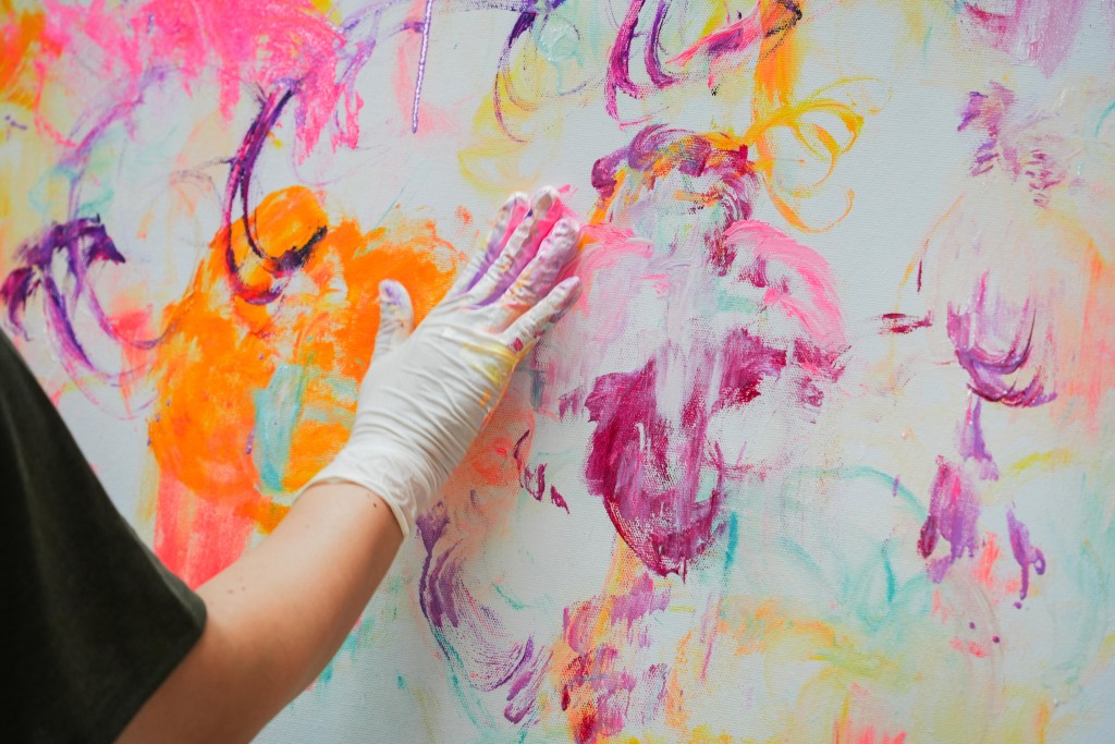 Ayako Rokkaku paints directly with her hands, allowing instinct to guide each movement as forms emerge naturally on the canvas.