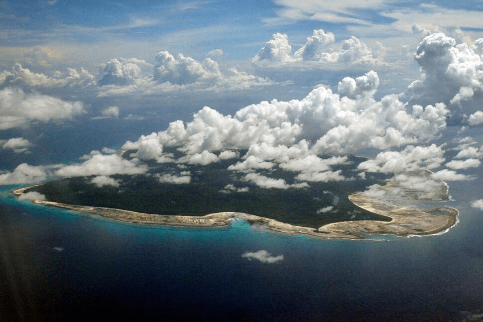 FILE – Clouds hang over the North Sentinel Island, in India's southeastern Andaman and Nicobar Islands, Nov. 14, 2005. (AP Photo/Gautam Singh, File)