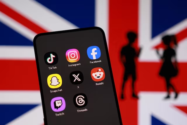 Union Jack flag, social media app icons and a silhouette of children are seen in this illustration taken June 15, 2026. REUTERS/Dado Ruvic/Illustration