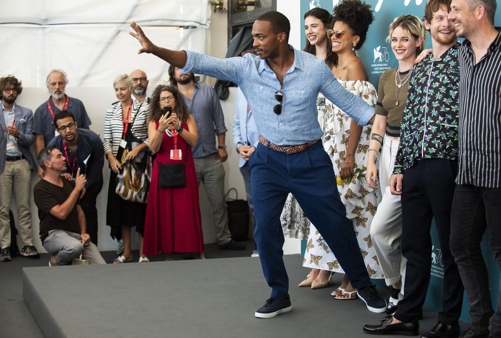 Actor Anthony Mackie gestures to photographers at the photo call for the film 'Seberg' at the Venice Film Festival.