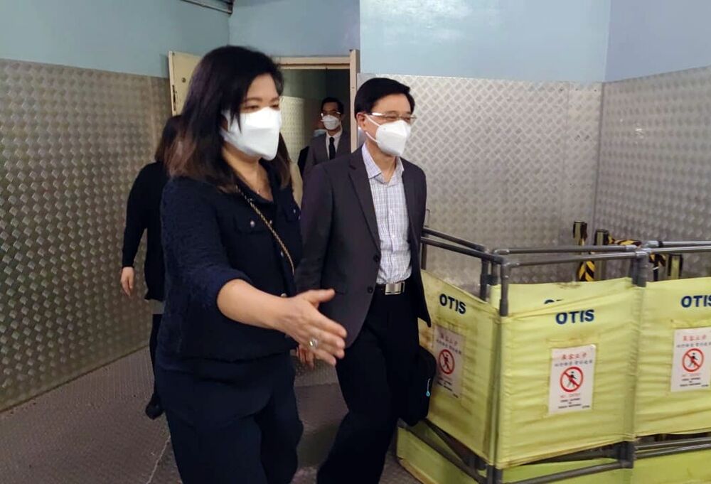 Seen with John Lee yesterday are Joanne Cheung, left, and Jenny Wong, below right, with the rest of the team comprised of, clockwise from right, Daryl Ng, Pauline Ng, Tam Yiu-chung, Raymond Tam and Eliza Chan. SING TAO, XINHUA