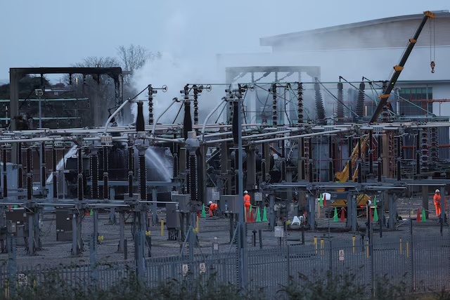 People work at an electrical substation, after a fire there wiped out the power at Heathrow International Airport, in Hayes, London, Britain, March 21, 2025. REUTERS/Isabel Infantes/File Photo 