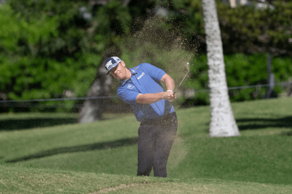 Patrick Fishburn hits his fairway bunker shot on the 16th hole during the second round of the Sony Open golf tournament at Waialae Country Club. (Kyle Terada-Imagn) Patrick Fishburn hits his fairway bunker shot on the 16th hole during the second round of the Sony Open golf tournament at Waialae Country Club. (Kyle Terada-Imagn)
