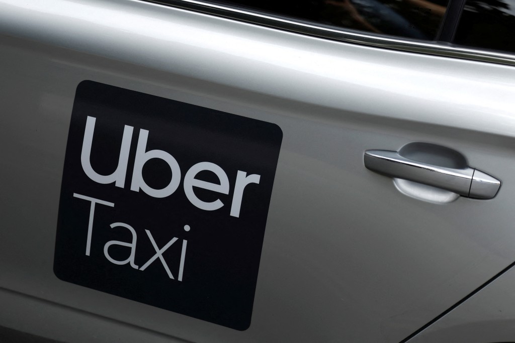 The Uber logo is seen on the side of a taxi, in Dublin, Ireland, June 29, 2025. REUTERS