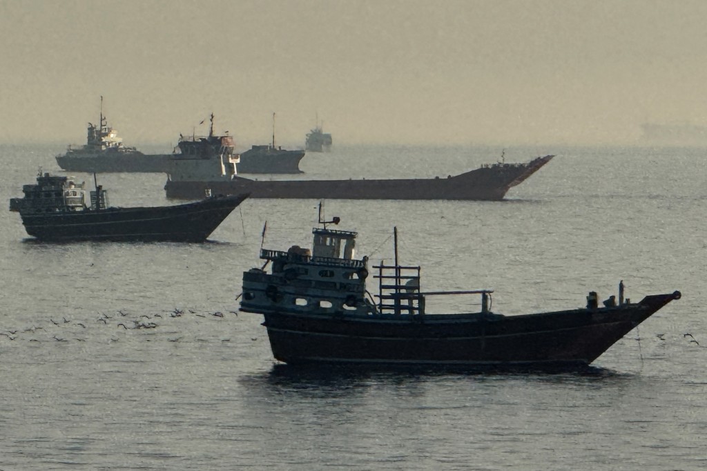 Photo by - / AFP Vessels are seen anchored in the Strait of Hormuz, off the port city of Khasab on Oman’s northern Musandam Peninsula on May 17, 2026.