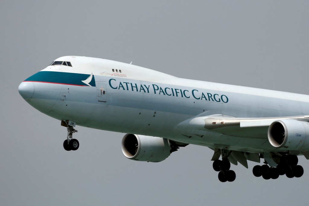 A Cathay Pacific Cargo Boeing 747-8F plane descends before landing at Hong Kong Airport in Hong Kong, China April 4, 2018.      REUTERS/Bobby Yip/File Photo