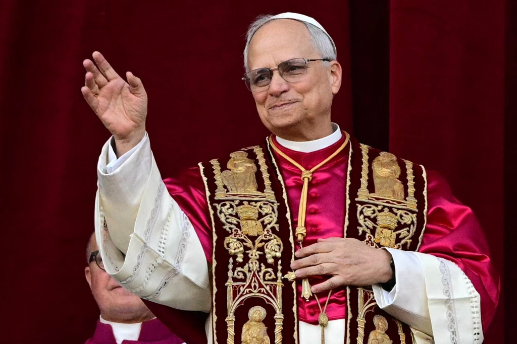 Photo by TIZIANA FABI / AFP  Newly elected Pope Leo XIV, Robert Prevost from the main central loggia balcony of the St Peter's Basilica for the first time, after the cardinals ended the conclave, in The Vatican, on May 8, 2025.