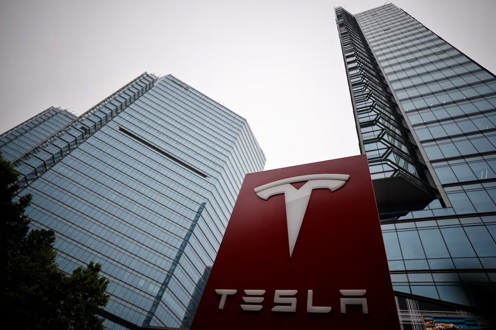 A Tesla logo is seen outside a showroom of the carmaker in Beijing, China, May 31, 2023. REUTERS A Tesla logo is seen outside a showroom of the carmaker in Beijing, China, May 31, 2023. REUTERS
