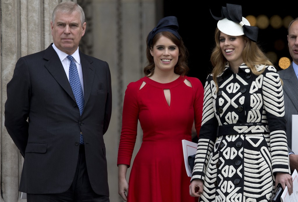 Photo by JUSTIN TALLIS / AFP  Britain's Prince Andrew (L), Britain's Princess Eugenie of York (2nd L), Britain's Princess Beatrice of York (R) leave after attending a national service of thanksgiving for the 90th birthday of Britain's Queen Elizabeth II at St Paul's Cathedral in London on June 10, 2016, which is also the Duke of Edinburgh's 95th birthday.