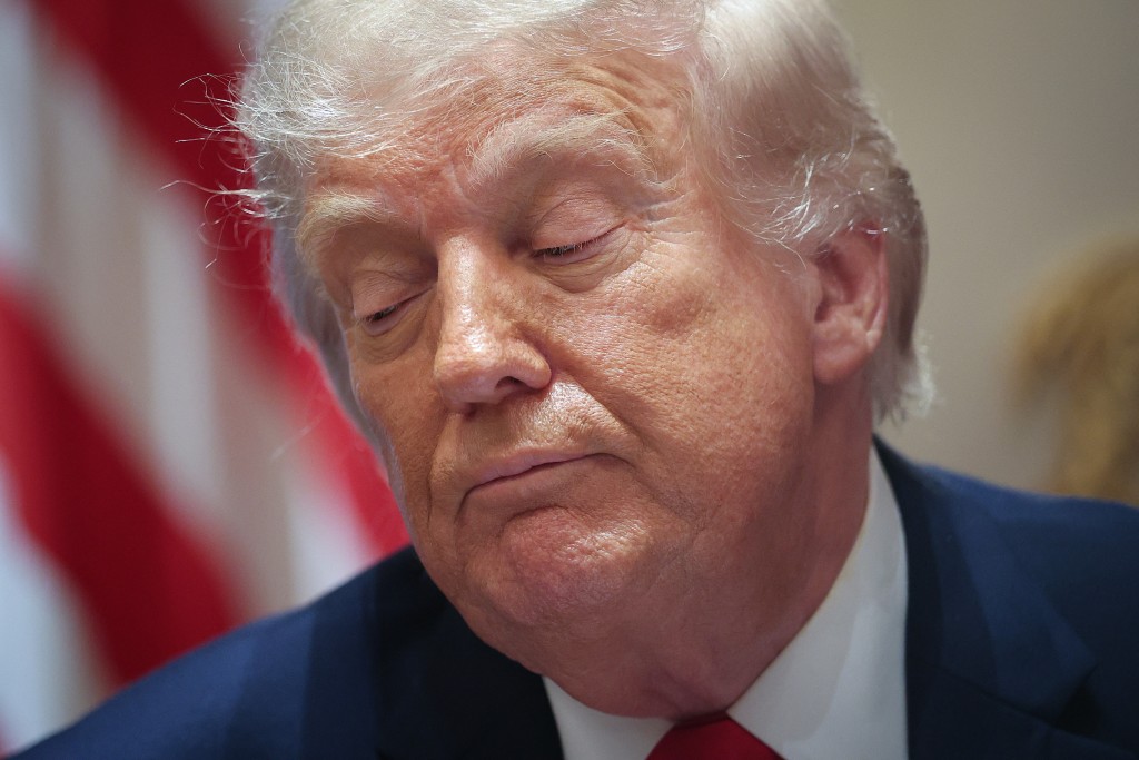 U.S. President Donald Trump listens to members of his Cabinet speak during a meeting in the Cabinet Room of the White House on May 27, 2026 in Washington, DC. Trump meets with his Cabinet days after saying a peace deal with Iran was “largely negotiated” amid expectations around the re-opening the Strait of Hormuz. Win McNamee/Getty Images/AFP