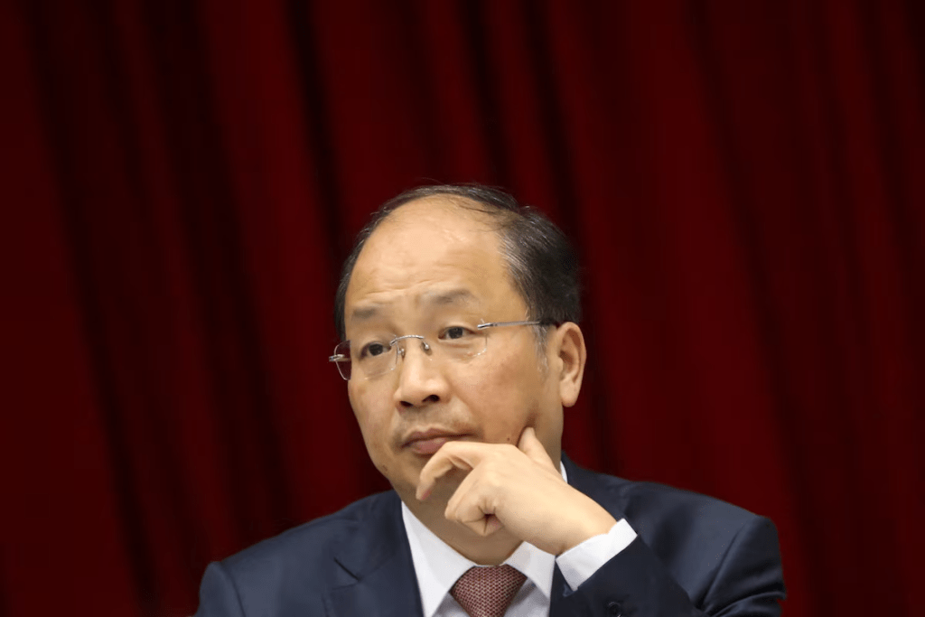 Yi Huiman, then-chairman of China Securities Regulatory Commission (CSRC), attends a meeting of Fujian delegation on the sidelines of the National People's Congress (NPC), at the Great Hall of the People in Beijing, China March 5, 2019. Picture taken March 5, 2019. REUTERS/Stringer/File Photo