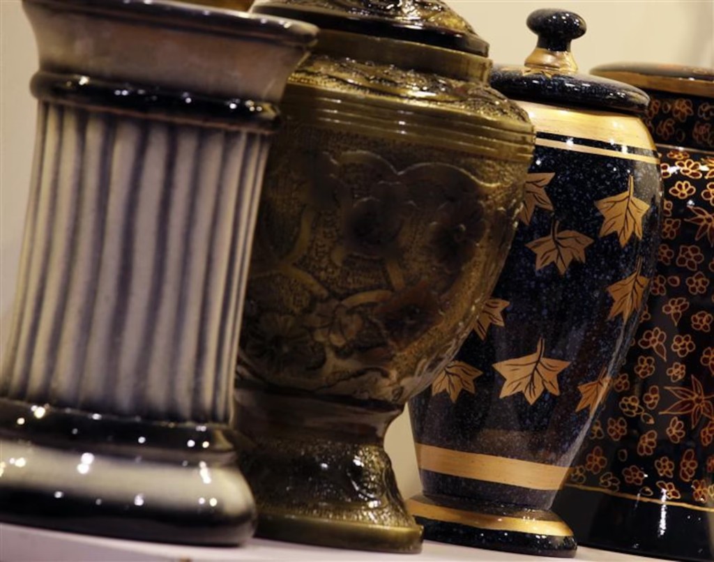 Urns made by an Indian company are shown during Asia Funeral Expo (AFE) in Hong Kong May 19, 2011. REUTERS/Bobby Yip
