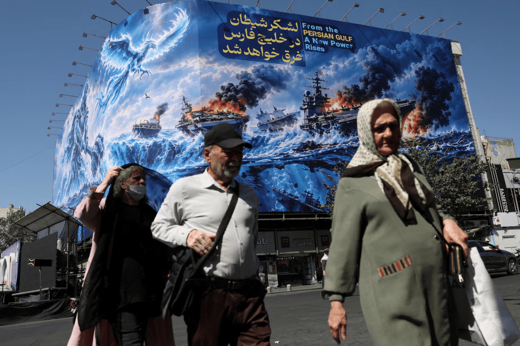 People walk past a billboard about the Strait of Hormuz, on a building in Tehran, Iran, September 16, 2026. Majid Asgaripour/WANA (West Asia News Agency) via REUTERS/File Photo