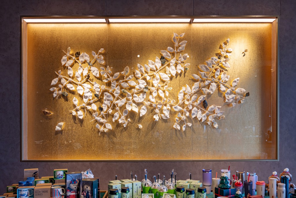 Chinese “Starbucks” signage by calligrapher Westley Wong, ceramic wall installation by porcelain sculptor Leo Wong, and the painting series created with natural minerals and earth pigments by artist Elsa Ngai (from top to bottom)