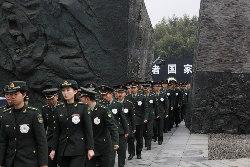 Participants attend the memorial ceremony to mark the 88th anniversary of the 1937 Nanjing Massacre on the National Memorial Day at the Nanjing Massacre Museum in Nanjing, Jiangsu Province, China, December 13, 2025. REUTERS/Staff