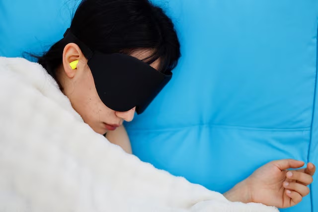 A participant sleeps during the 2026 Power Nap contest at Han River park in Seoul, South Korea, May 2, 2026. REUTERS/Kim Soo-hyeon
