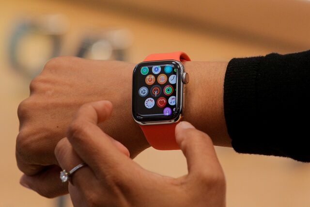 An Apple Store employee shows the Series 5 Apple Watch during the preview of the redesigned and reimagined Apple Fifth Avenue store in New York, U.S., September 19, 2019. REUTERS/Brendan McDermid/File Photo