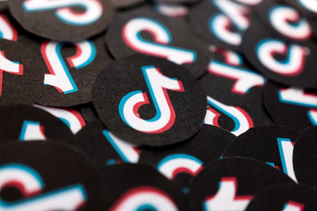 Printed TikTok logos are seen in this illustration taken February 15, 2022. REUTERS/Dado Ruvic/Illustration/File Photo 