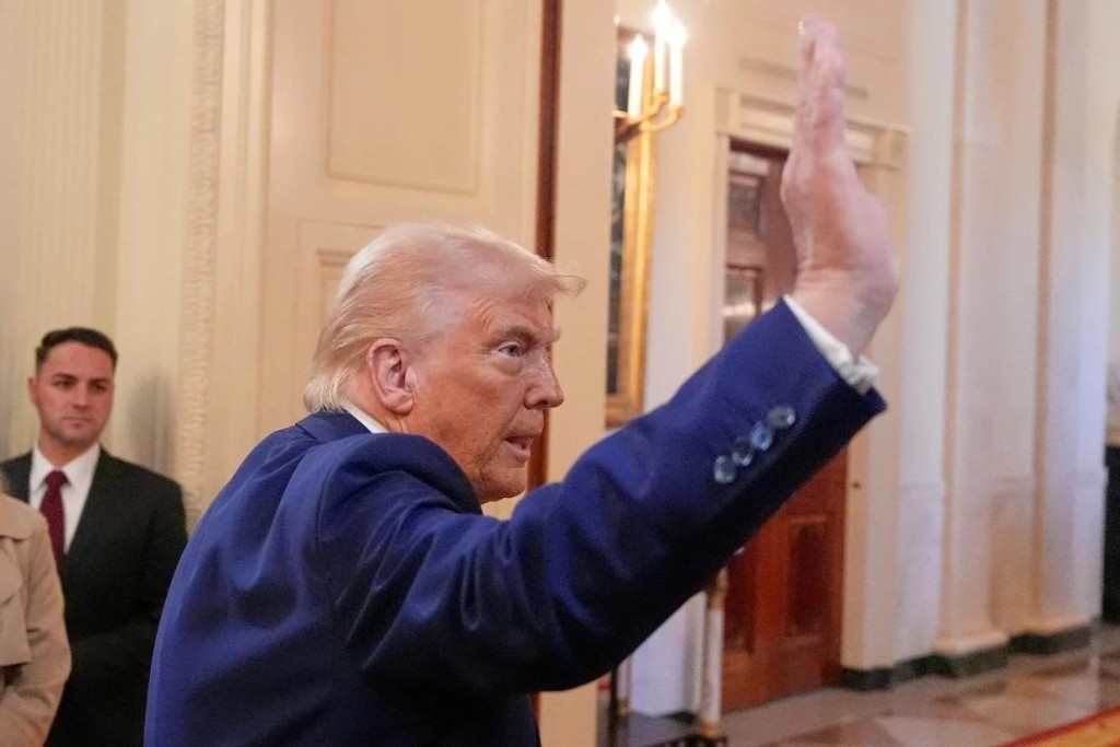 President Donald Trump departs after an event in the East Room of the White House. AP