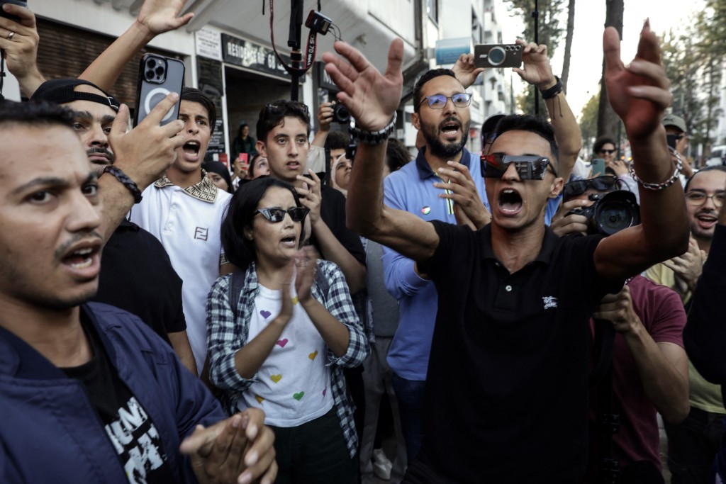 Moroccan youths demonstrate demanding reforms in the healthcare and education sectors in Rabat on October 2, 2025. Morocco was set for a sixth night of protests on October 2 as the country's prime minister appealed for engagement with demonstrators, a day after three people were killed in clashes in the southern city of Agadir. (Photo by Abdel Majid BZIOUAT / AFP)