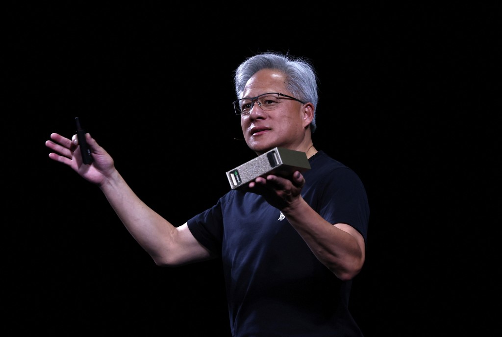 Jensen Huang, CEO of Nvidia, holds a NVIDIA DGX Cloud Lepton as he speaks during the Viva Technology conference dedicated to innovation and startups at Porte de Versailles exhibition center in Paris, France, June 11, 2025. REUTERS/Gonzalo Fuentes
