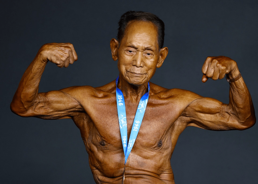 Bodybuilding - IFBB World Fitness Championships - Santa Susanna, Spain - October 30, 2026 90 year old bodybuilder Japan's Toshisuke Kanazawa poses with his participation medal after the event REUTERS/Albert Gea