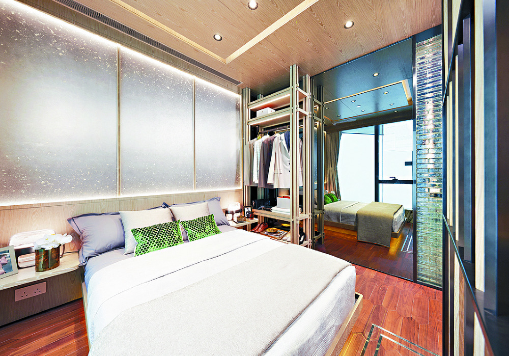 SPACIOUS AND SERENE: The master bedroom combines with the second bedroom to offer more space and a separate study area.