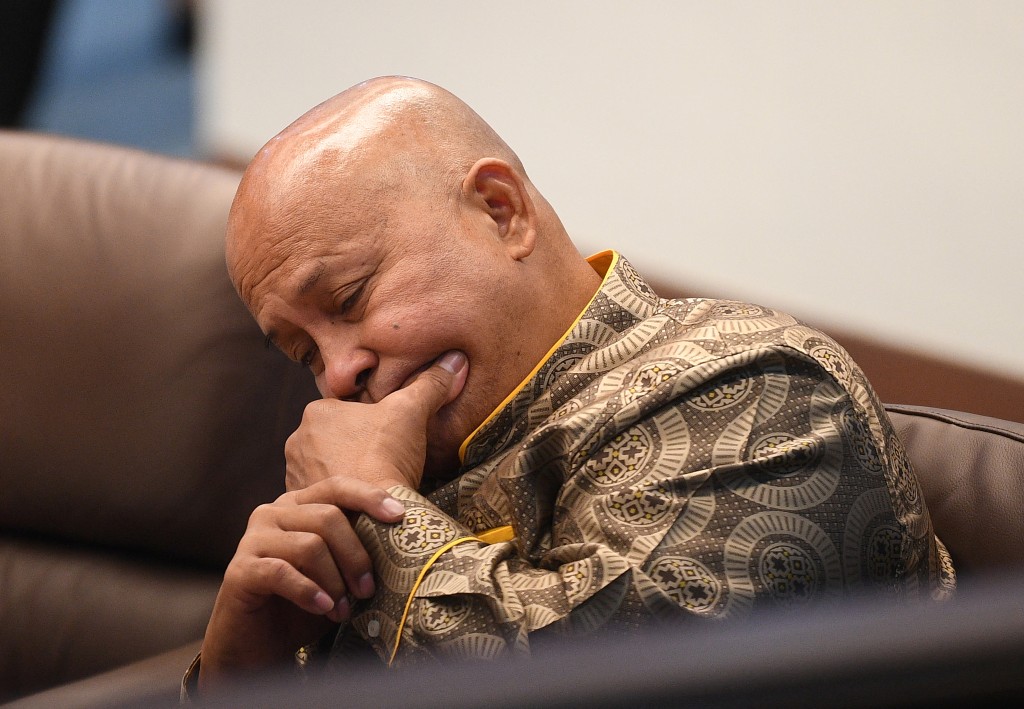 Photo by TED ALJIBE / AFP  In this photo taken on May 13, 2026, Ronald Dela Rosa, a fugitive senator wanted by the International Criminal Court over his role in the nation's deadly drug war, attends a senate session in Manila.