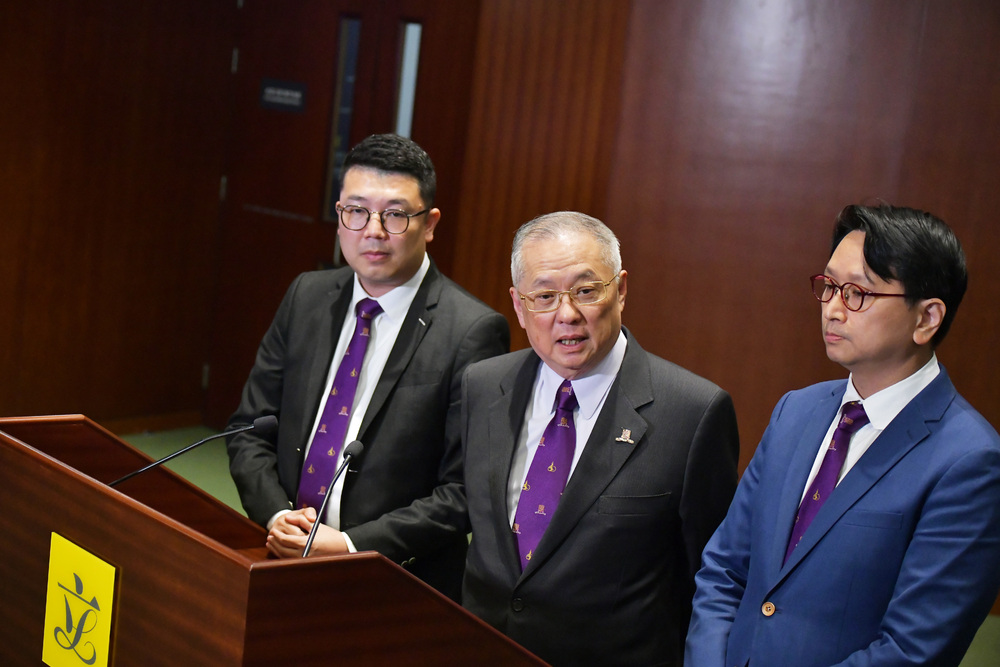 The law amendment was tabled by, from left, Edward Lau, Tommy Cheung and Bill Tang, who wore CUHK ties at yesterday's vote. SING TAO The law amendment was tabled by, from left, Edward Lau, Tommy Cheung and Bill Tang, who wore CUHK ties at yesterday's vote. SING TAO