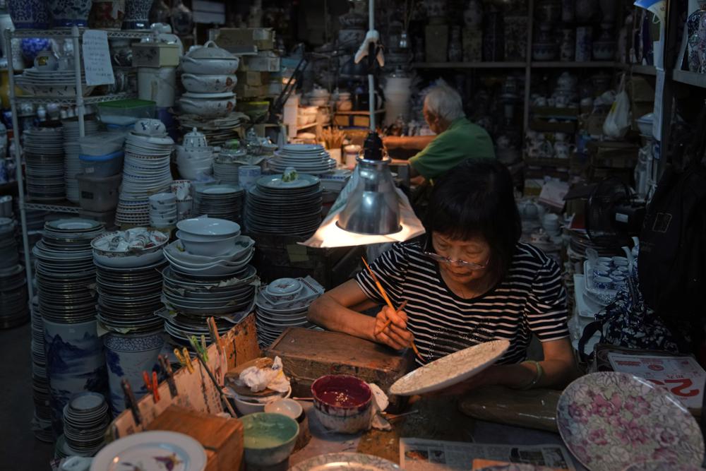 Staff members work at the Yuet Tung China Works. (AP) Staff members work at the Yuet Tung China Works. (AP)