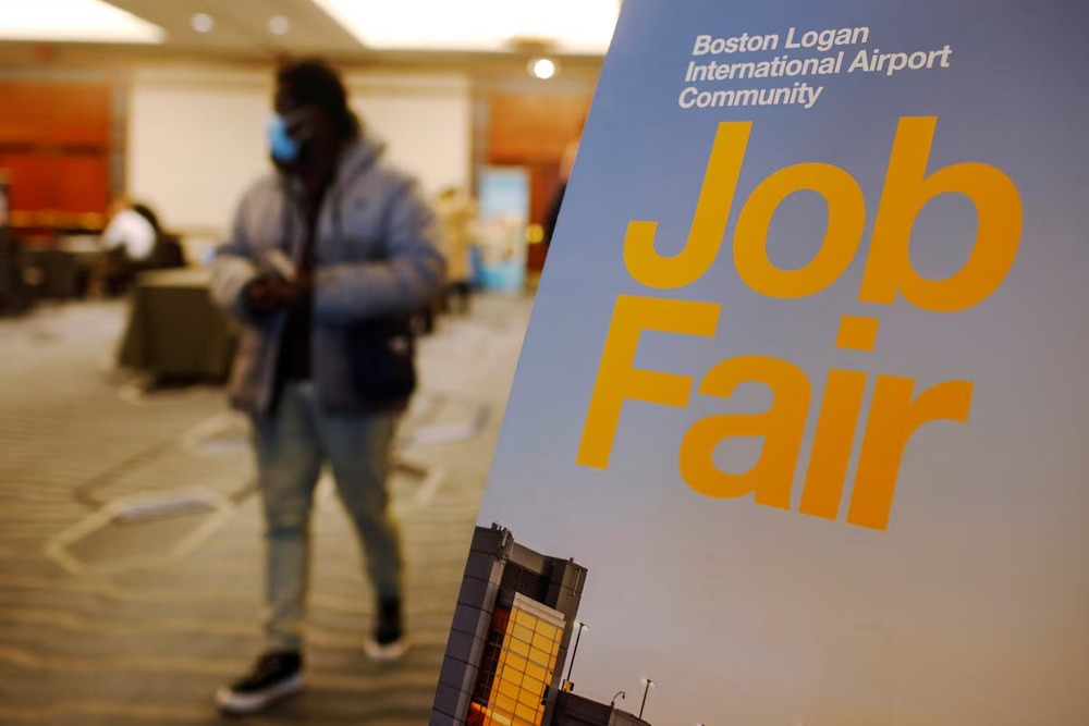 A job seeker leaves the job fair for airport related employment at Logan International Airport in Boston, Massachusetts, U.S., December 7, 2021. REUTERS