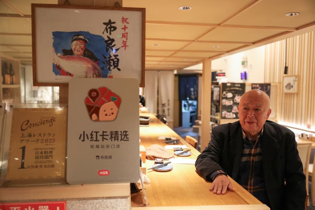 Takashi Ito, the owner of the Japanese restaurant Merase, which serves seafood such as sushi and sashimi, speaks during an interview in Shanghai, China, November 19, 2025. REUTERS/Go Nakamura