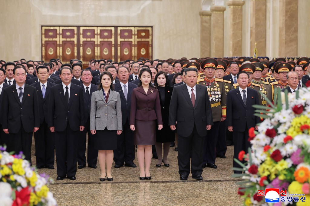 North Korean leader Kim Jong Un (C), his wife Ri Sol Ju and their daughter Kim Ju Ae visiting the Kumsusan Palace of the Sun to mark the new year in Pyongyang. (AFP)