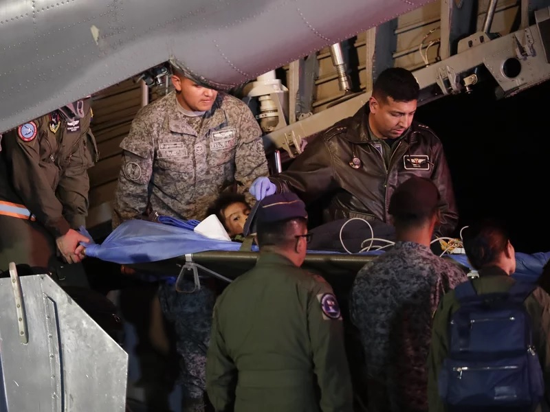 On Saturday in Bogota, Colombia, military personnel unload from a plane one of four Indigenous children who were missing after a deadly plane crash. (AP) On Saturday in Bogota, Colombia, military personnel unload from a plane one of four Indigenous children who were missing after a deadly plane crash. (AP)
