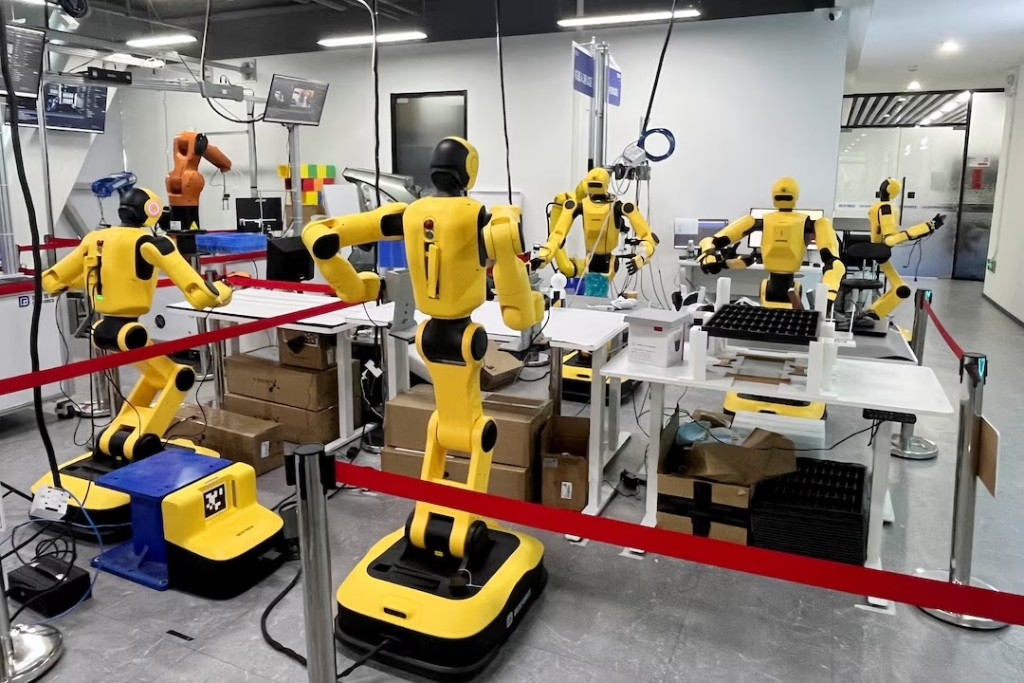 DexForce W1 Pro humanoid robots demonstrate object sorting at an industrial deployment testing facility at the company's headquarters in Shenzhen, Guangdong province, China October 14, 2026. REUTERS/Laurie Chen