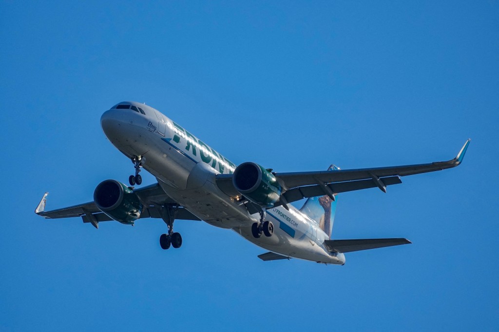 A Frontier Airlines plane approaches Ronald Reagan Washington National Airport near Alexandria, Virginia, U.S., December 24, 2025. REUTERS/Ken Cedeno